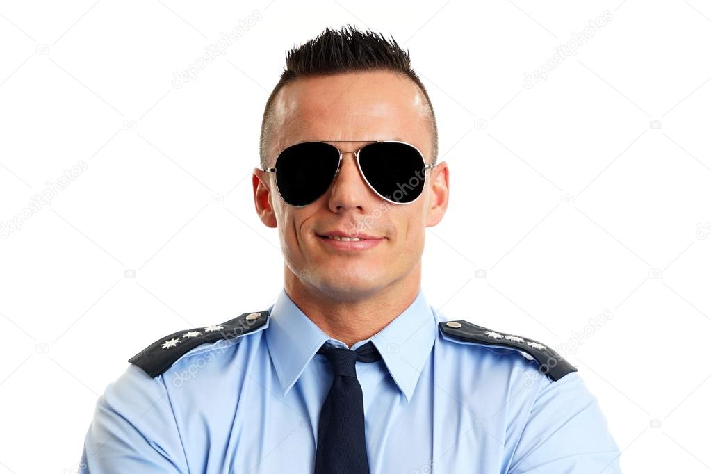 Smiling policeman in uniform with sunglasses