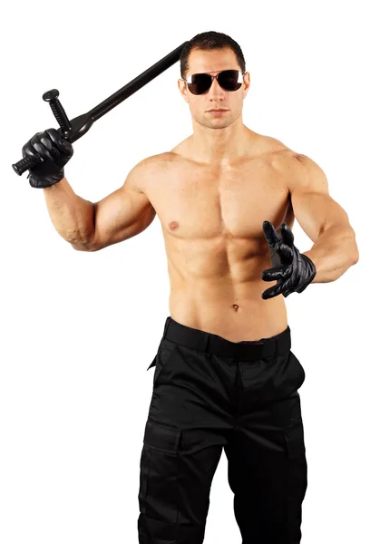 Man in sunglasses with nightstick in hand — Stock Photo, Image