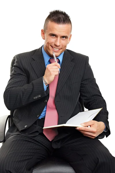 Handsome smiling man in suit thinking Royalty Free Stock Photos