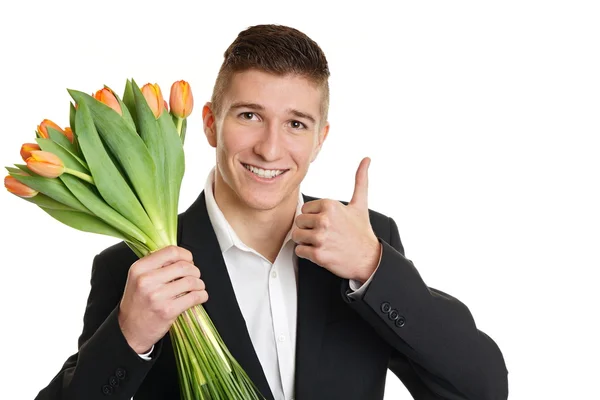 Man holds bouquet of tulips — Stock Photo, Image