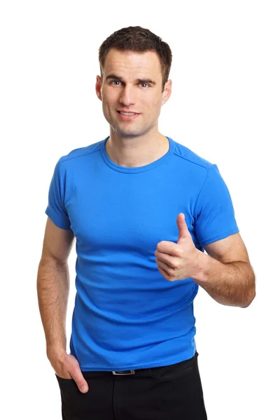 Young man gesturing thumb up sign — Stock Photo, Image