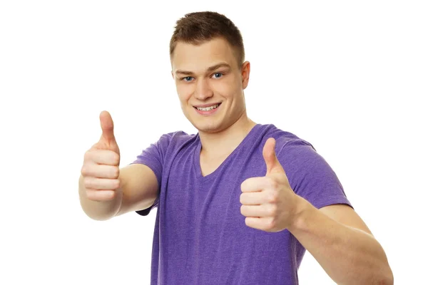 Young man showing thumbs up — Stock Photo, Image