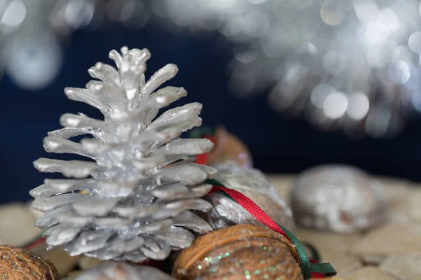 Christmas Decoration Close Painted Silver Cone Pine Red Green Ribbon — Stock Photo, Image