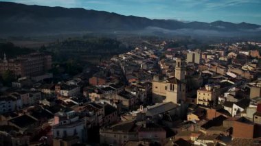 Footage of Espluga de Francoli town in Catalonia with sunrise and mountains in the back. High quality 4k drone footage