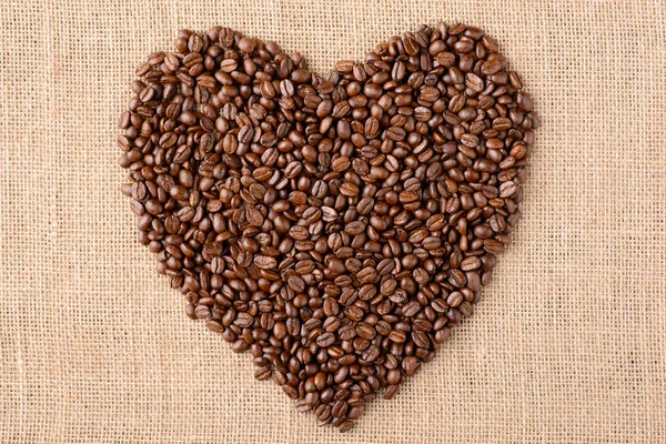 Heart of coffee on sacking — Stock Photo, Image