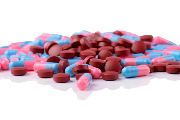 Colored capsules and tablets isolated — Stock Photo, Image