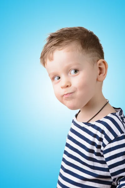 Niño pequeño en un chaleco a rayas —  Fotos de Stock