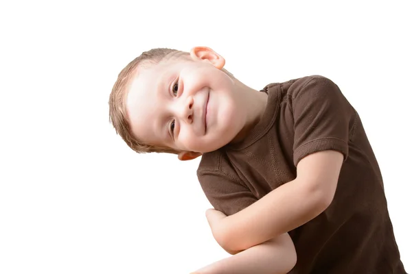 Kleine jongen glimlachend op een witte achtergrond — Stockfoto