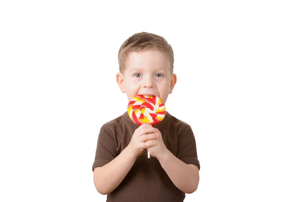 Kleine jongen een lolly houden — Stockfoto