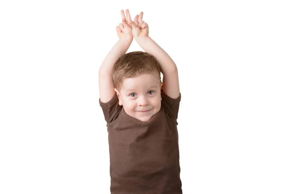 Petit garçon avec les mains levées Photo De Stock