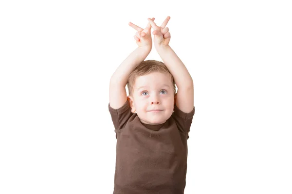 Little boy showing victory sign on the fingers Stock Photo