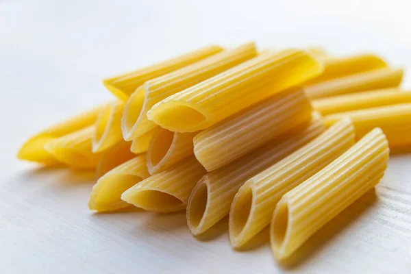 Pasta Raw Penne Rigate White Wooden Surface — Stock Photo, Image