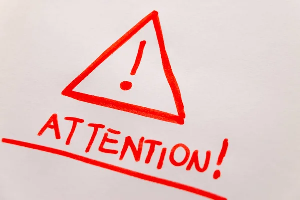 Attention Sign Drawn Red Marker Written Attention White Sheet Photographed — Stock Photo, Image