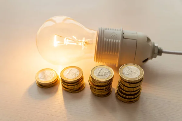 Lit Light Bulb Coins Increase Energy Tariffs Efficiency Energy Saving — Stock Photo, Image