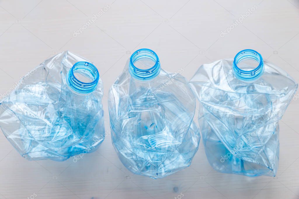 Crushed or crumpled clear plastic bottles. Plastic waste. Plastic