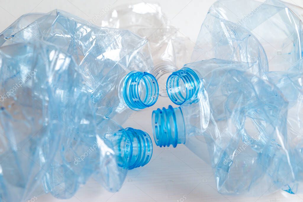 Crushed or crumpled clear plastic bottles. Plastic waste. Plastic