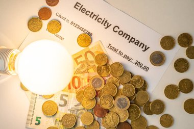 Ampul açık, banknotlar, sikkeler ve enerji faturalarıyla birlikte. Enerji ve gaz tarifelerinde artış. Verimlilik ve enerji tasarrufu.
