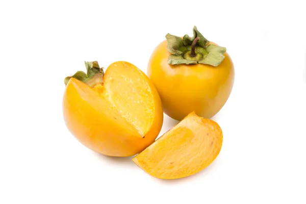Två persimmon på vit bakgrund — Stockfoto