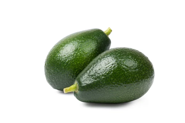 Zwei Avocados auf weißem Hintergrund — Stockfoto