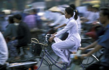 People riding a bikes in Ho Chi Minh clipart