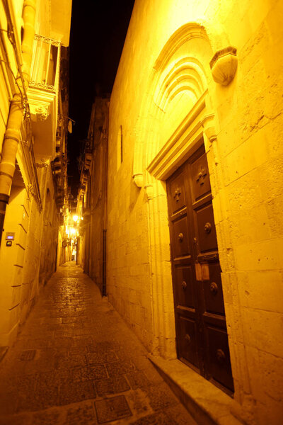 a small alley in old Town of Siracusa in the province of Sicily in Italy.   Italy, Sicily, October, 2014