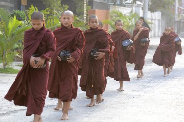 Young buddhist monks on road in Nyaungshwe