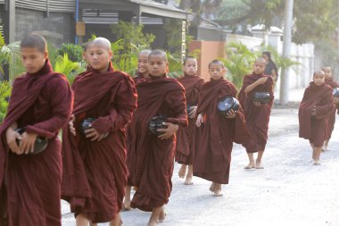Young buddhist monks on road in Nyaungshwe
