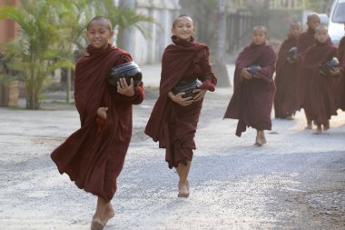Young buddhist monks on road in Nyaungshwe