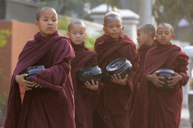 Young buddhist monks on road in Nyaungshwe