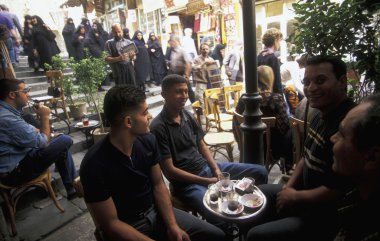 Arab men sitting at cafe  clipart
