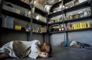 children sleeping on floor of convenience store clipart