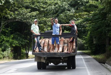 truck with workers near the town of Juangriego clipart