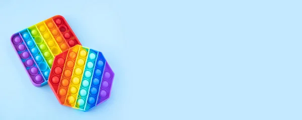 Colorido Stress Fidget Empurrar Pop Brinquedos Sensoriais Isolados Fundo Azul — Fotografia de Stock