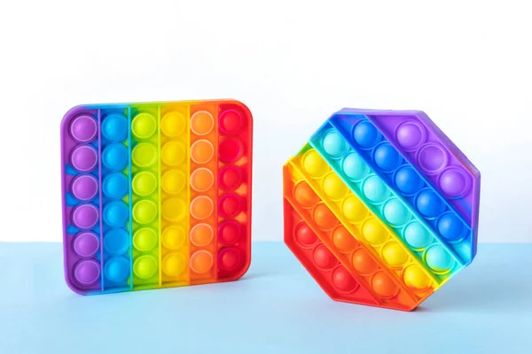 Colorido Stress Fidget Empurrar Pop Brinquedos Sensoriais Isolados Fundo Azul — Fotografia de Stock