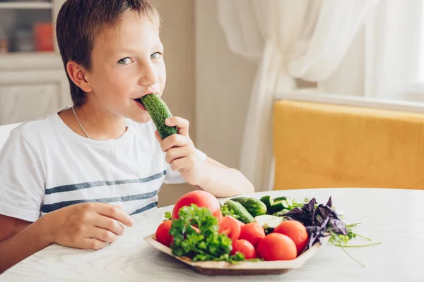 Boy Sitting Kitchen Eating Healthy Vegetables Cucumber Tomato — Stock Photo, Image