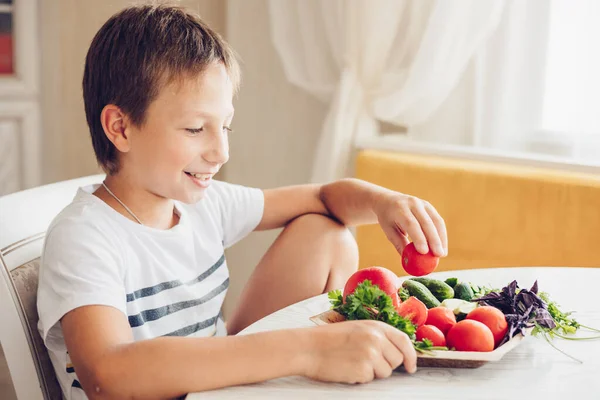 Boy Sitting Kitchen Eating Healthy Vegetables Cucumber Tomato — Stock Photo, Image