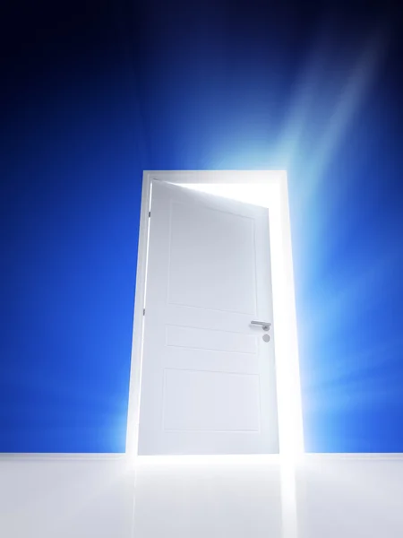 Open white door with rays of light on blue wall — Stock Photo, Image