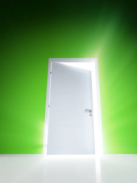 Open white door with rays of light on green wall — Stock Photo, Image