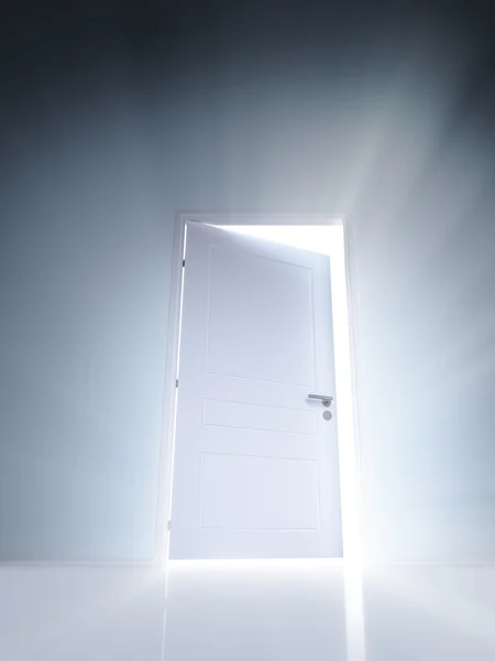 Open white door with rays of light on blue wall — Stock Photo, Image