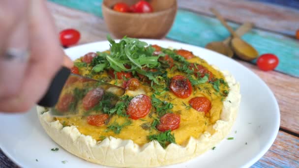 Close up of cutting a piece of quiche with kitchen knife. — Stock Video