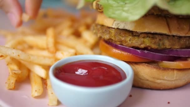 Close up of french fry dipping into ketchup. Street food concept — Stock Video