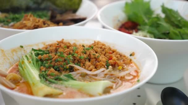 Healthy popular Asian street food. Close up of various types of traditional Japanese ramen soups served in white porcelain bowls — Stock Video