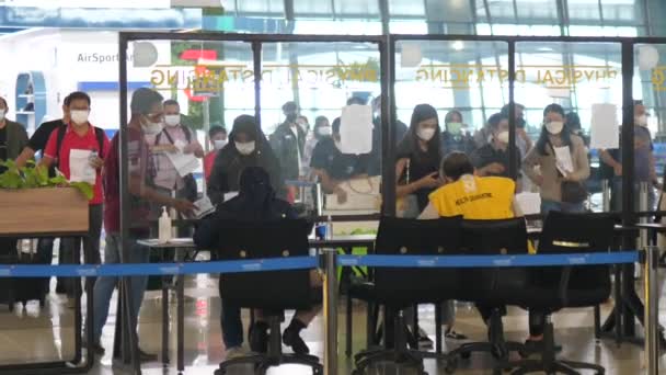 Passengers showing their covid test results to the airport staff. Bali-June-2021 — Stock Video