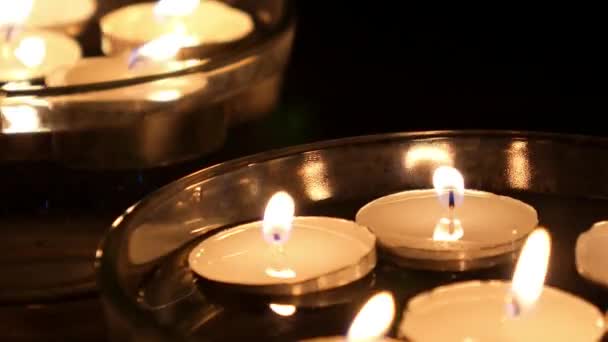 White Candles Floating on Water in Bowl at Night. — Stock Video