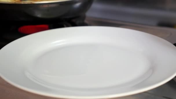 Closeup of Fried Pancake on the Plate near Frying Pan — Stock Video