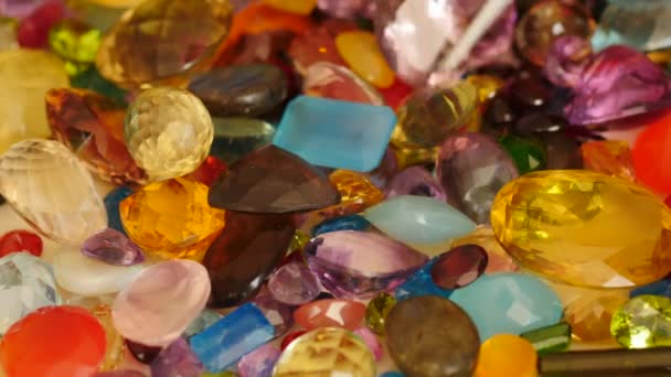 Pincers  moves for research among precious gemstones — Stock Video