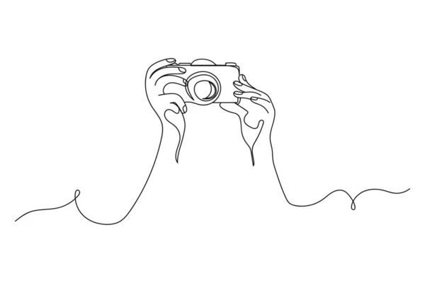 Contínua Uma Linha Mãos Segurando Uma Câmera Fotográfica Silhueta Fundo — Vetor de Stock