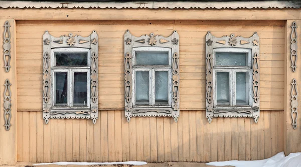 Russia. Suzdal. Three windows with carved wooden frames. — Stock Photo, Image