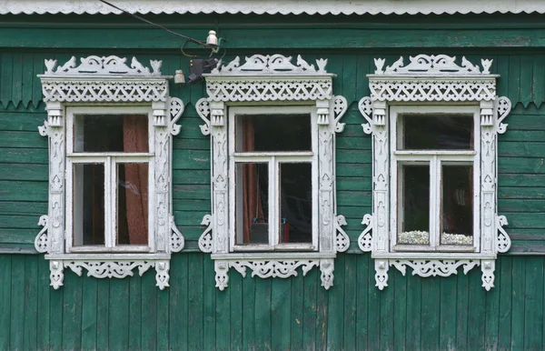 Russia. Vereya. Three windows with carved architraves. — Stock Photo, Image