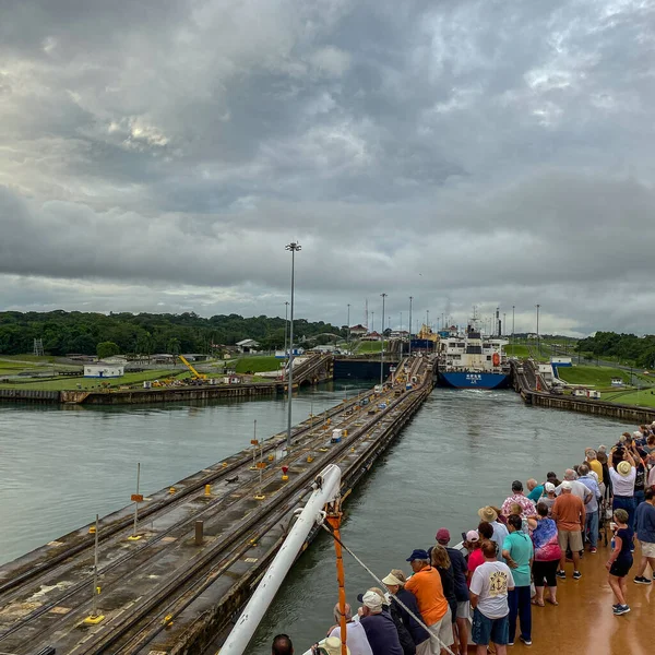 stock image Panama - 11/6/19: A cruise ship with the passengers on the bow watching the ship enter the Panama Canal.